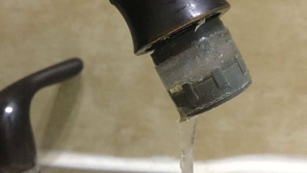 Camper faucet frozen with water in the line, cracked and protruding.