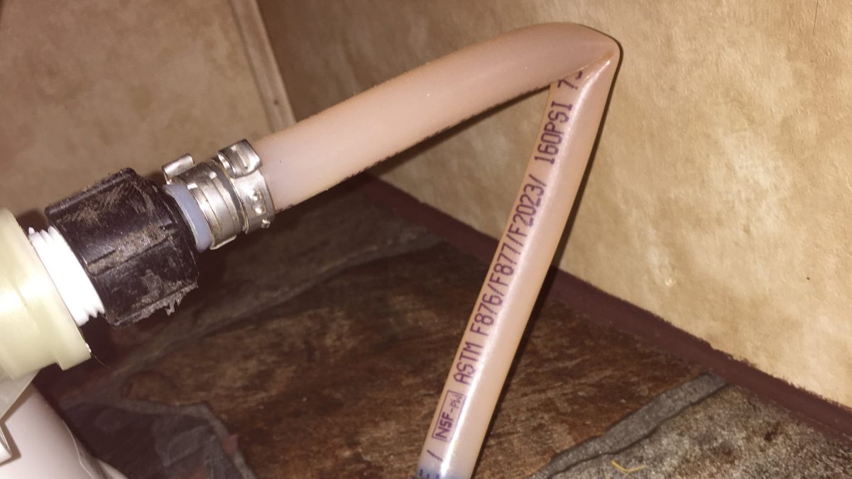 Camper toilet with a full kink in the plumbing.