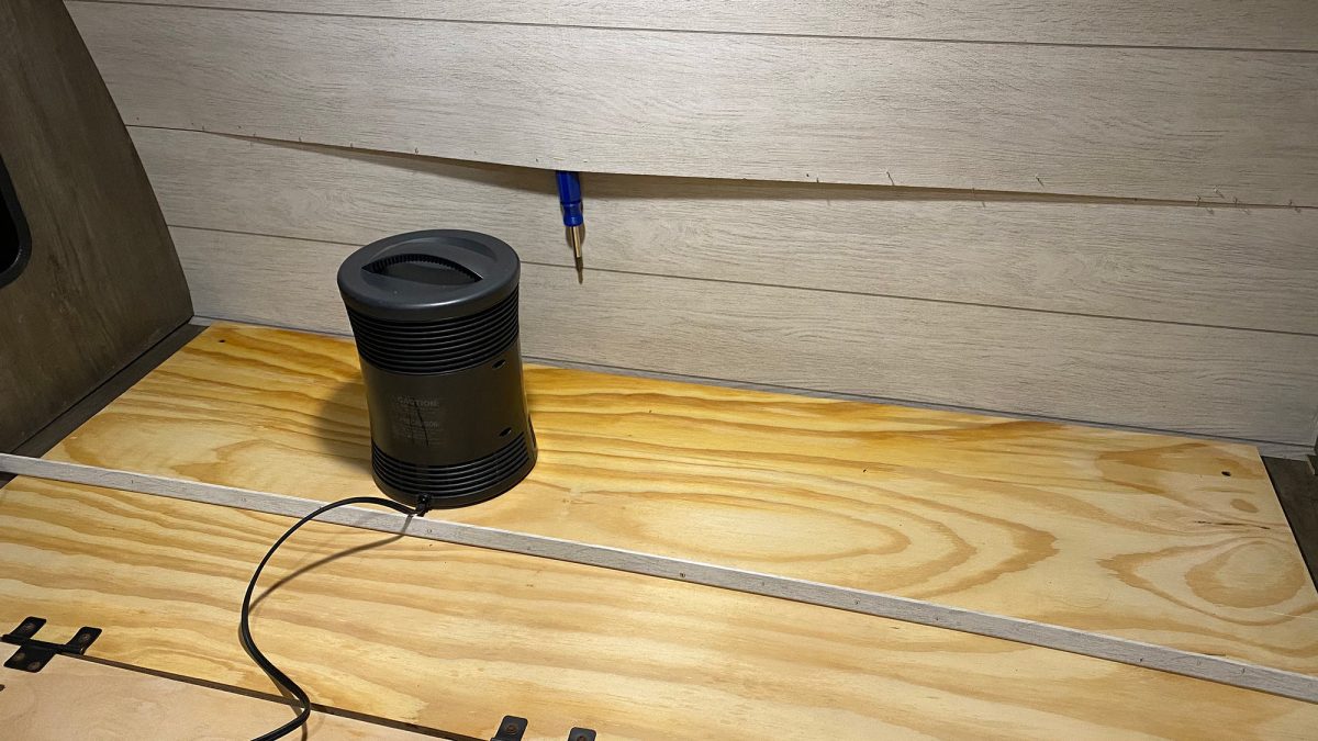 Camper wall and bed drenched by a massive roof leak on a rainy day.