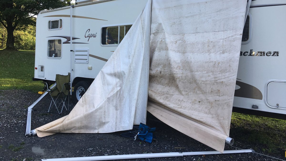 A camper awning ripped off by a flash flood that landed on it.